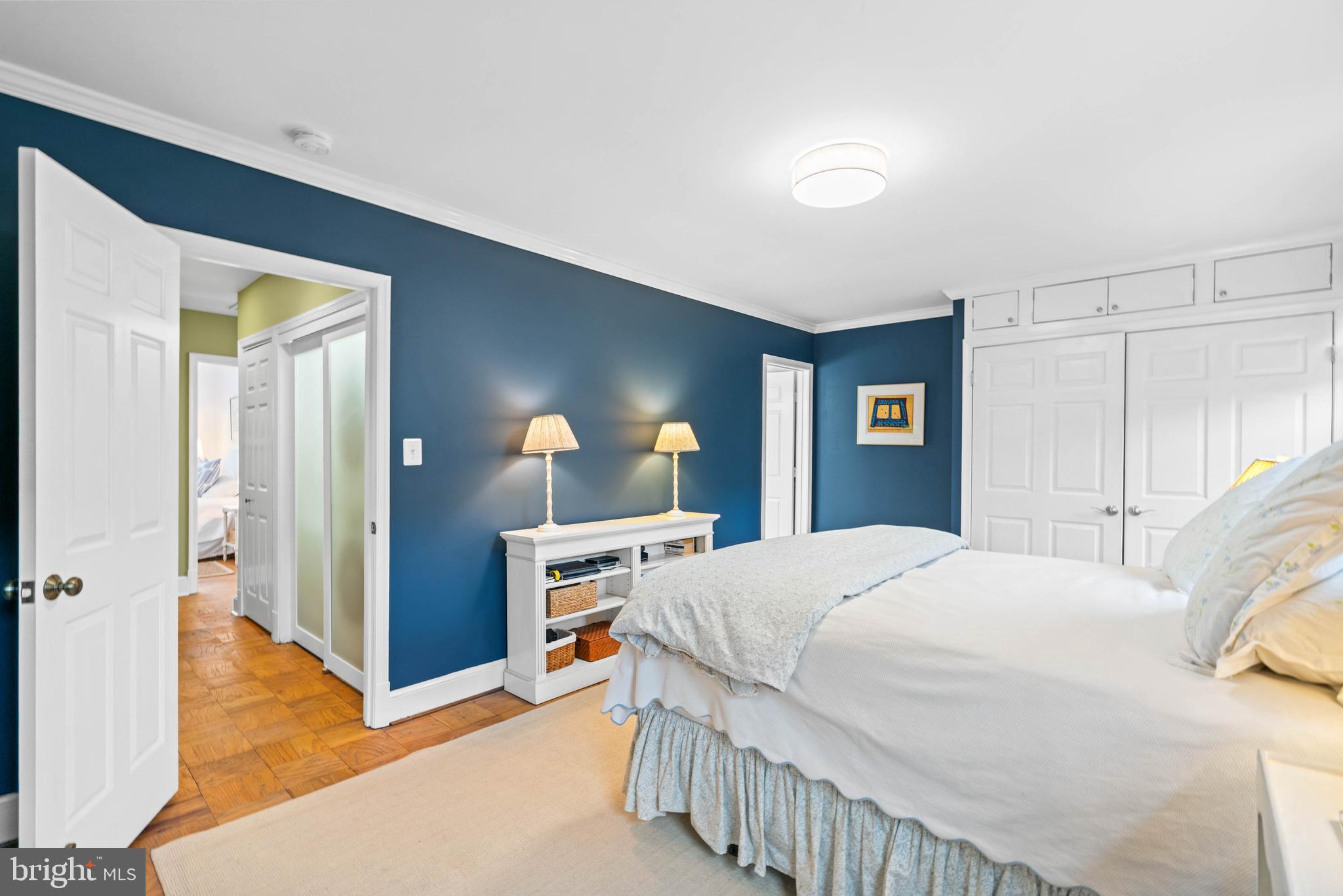 3297 Sutton Place Northwest, Unit B Washington, DC 20016 - Photo 41 of 43 a bedroom with a bed and a dresser
