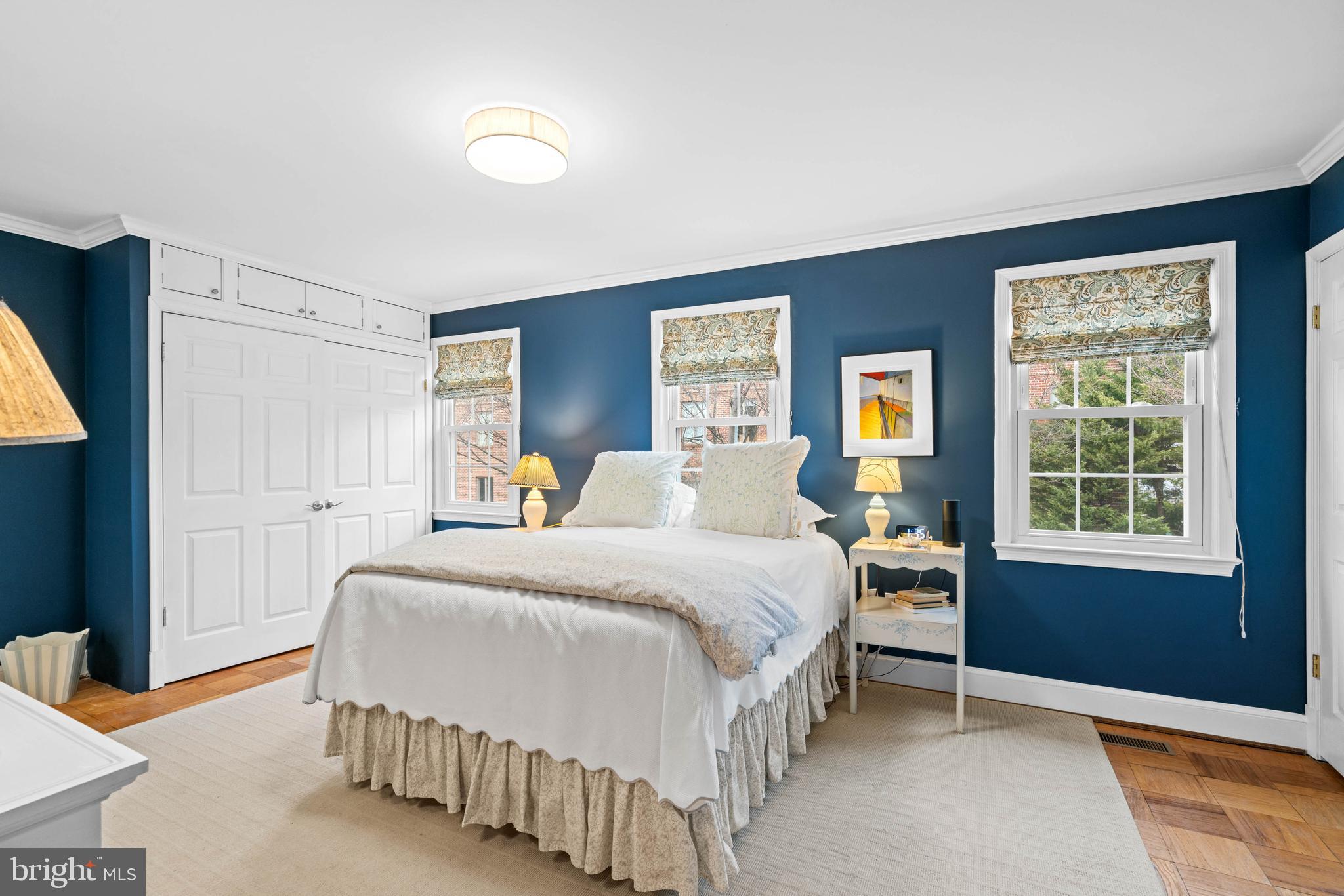 3297 Sutton Place Northwest, Unit B Washington, DC 20016 - Photo 42 of 43 a bedroom with a bed and a window