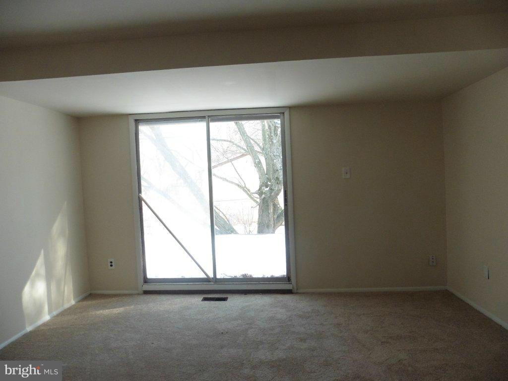 9429 Kilimanjaro Road Columbia, MD 21045 - Photo 13 of 13 an empty room with a window