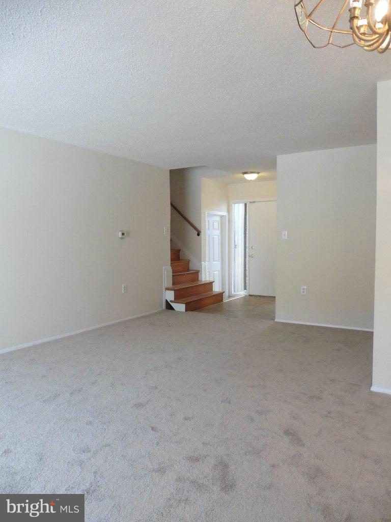 9429 Kilimanjaro Road Columbia, MD 21045 - Photo 7 of 13 a view of a big room with staircase