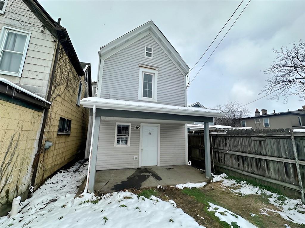 910 9th Avenue Beaver Falls, PA 15010 - Photo 3 of 11 a front view of a house with wooden fence