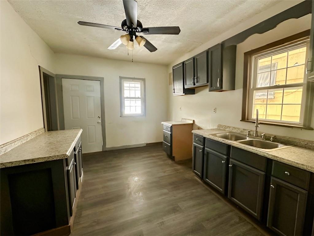 910 9th Avenue Beaver Falls, PA 15010 - Photo 5 of 11 a kitchen with sink cabinets and window