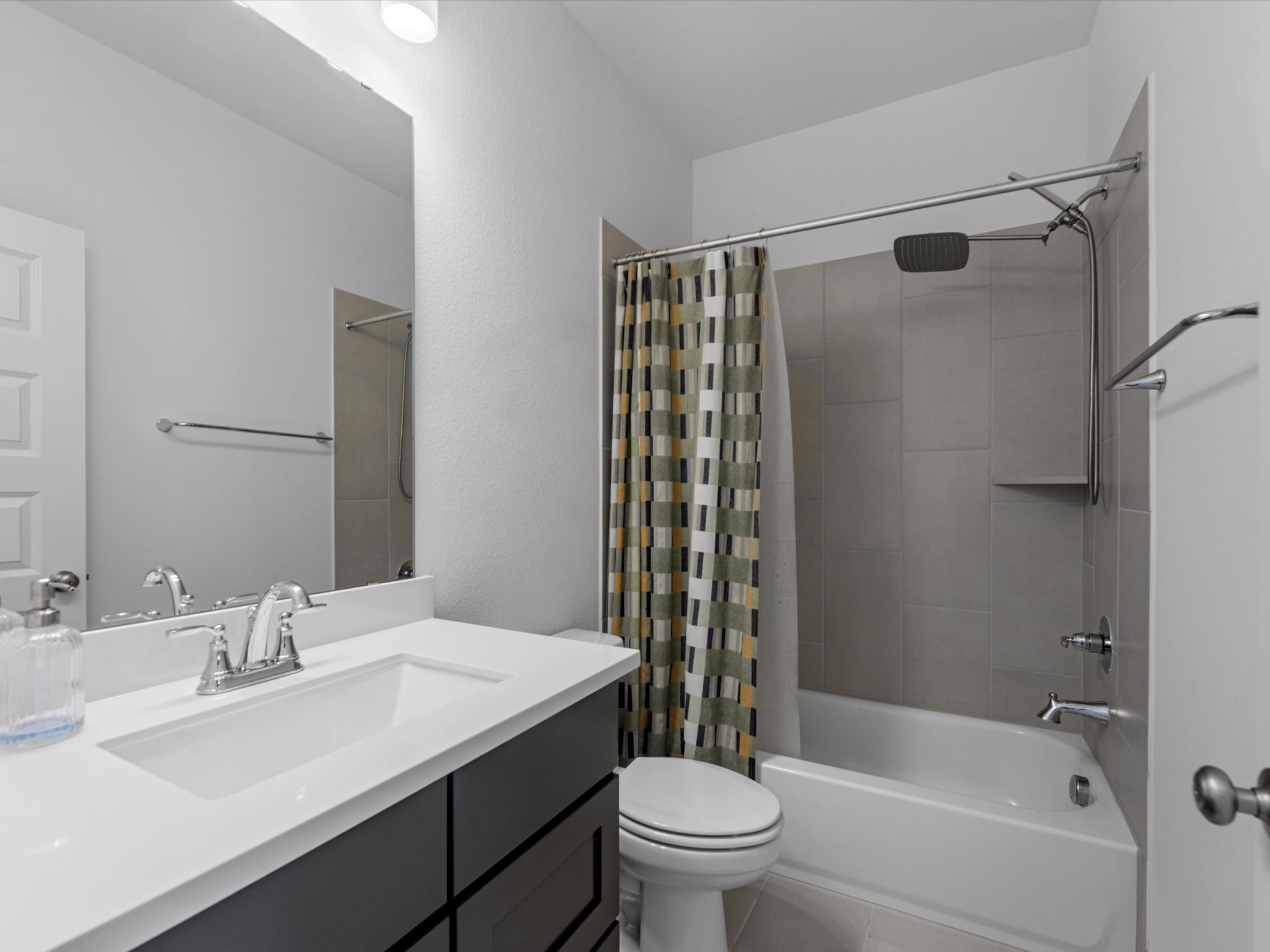 18714 Pistachio Way Manvel, TX 77578 - Photo 34 of 48 Conveniently located just outside the game and media rooms, this full bath is perfectly positioned for guests while also serving the adjacent bedroom.