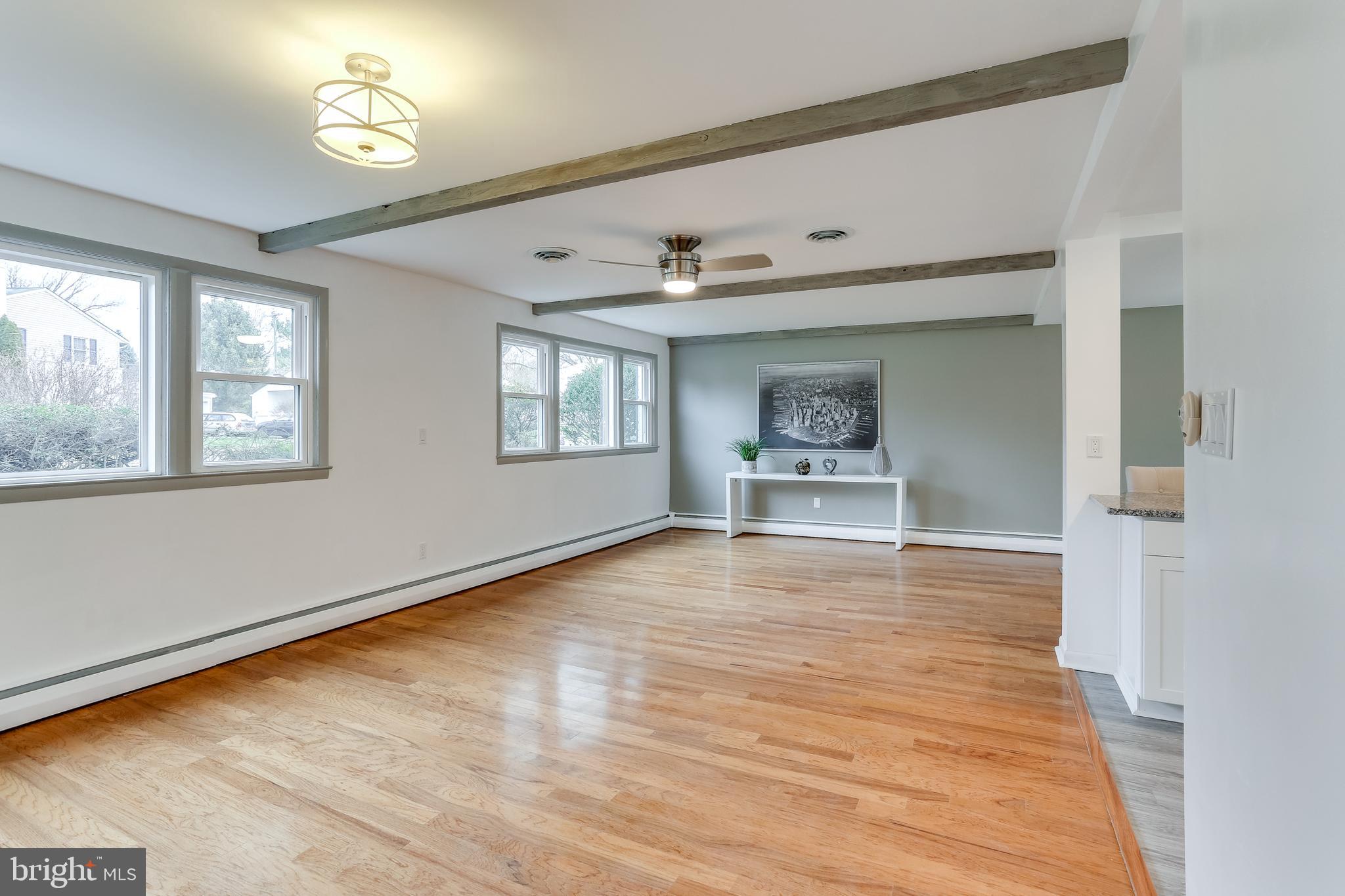 221 Coldbrook Road Lutherville-Timonium, MD 21093 - Photo 21 of 37 Large Family room off Kitchen w/ Wood Accent Beams