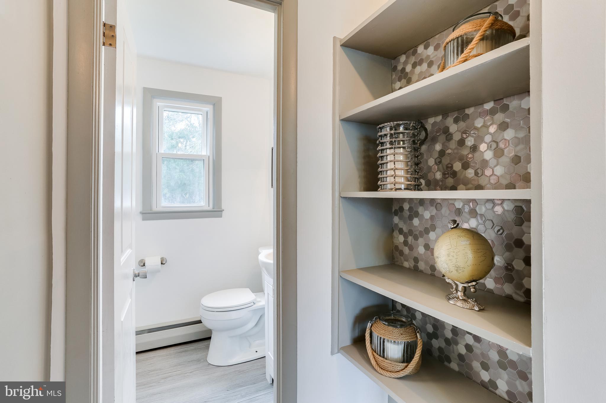 221 Coldbrook Road Lutherville-Timonium, MD 21093 - Photo 27 of 37 Shelves outside Half Bath w/Really Cool Backsplash
