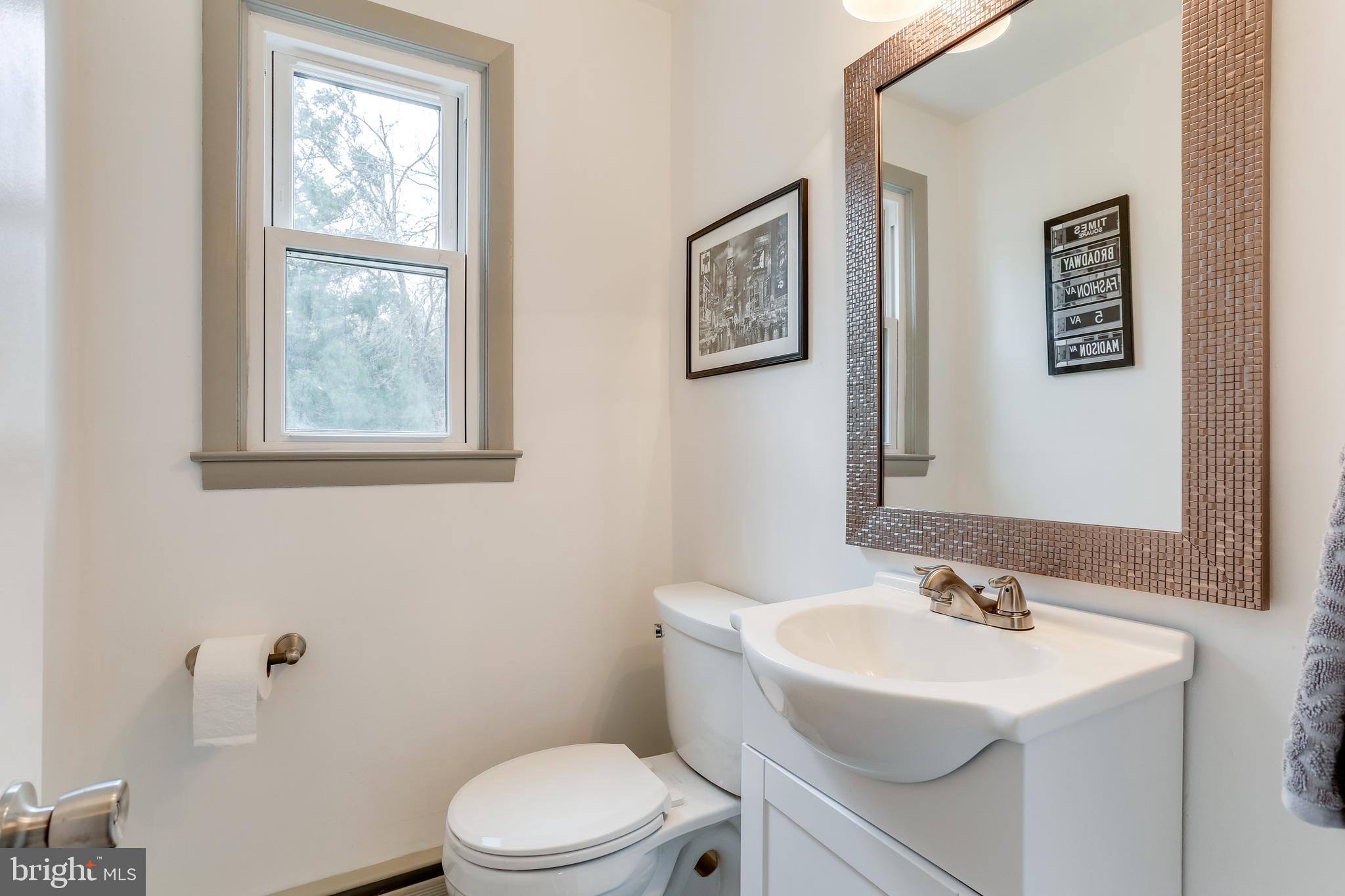 221 Coldbrook Road Lutherville-Timonium, MD 21093 - Photo 28 of 37 Half Bath with Large Metallic Mirror & Vanity.