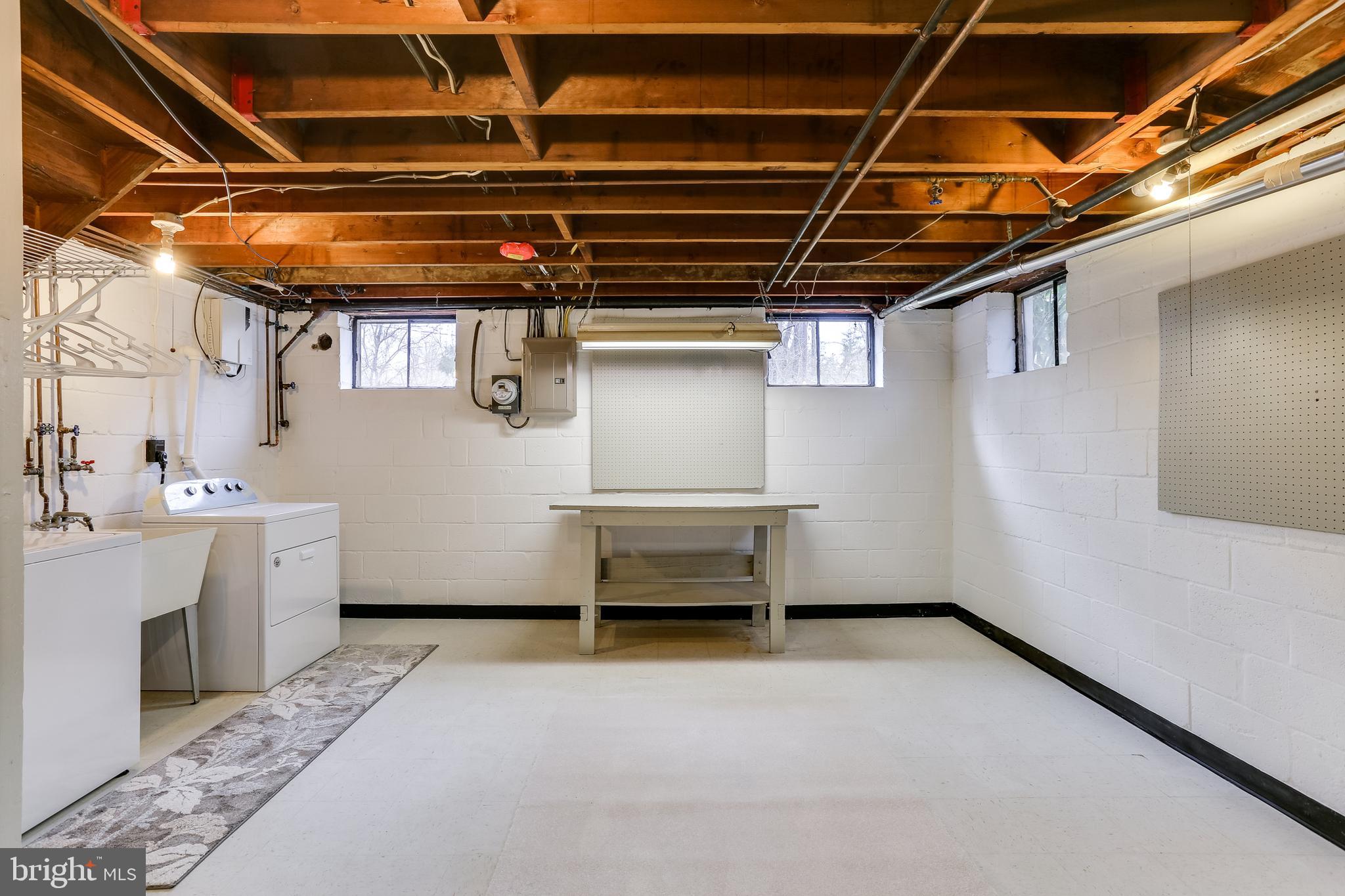 221 Coldbrook Road Lutherville-Timonium, MD 21093 - Photo 30 of 37 Open Painted Basement w/ Windows & Workbench.