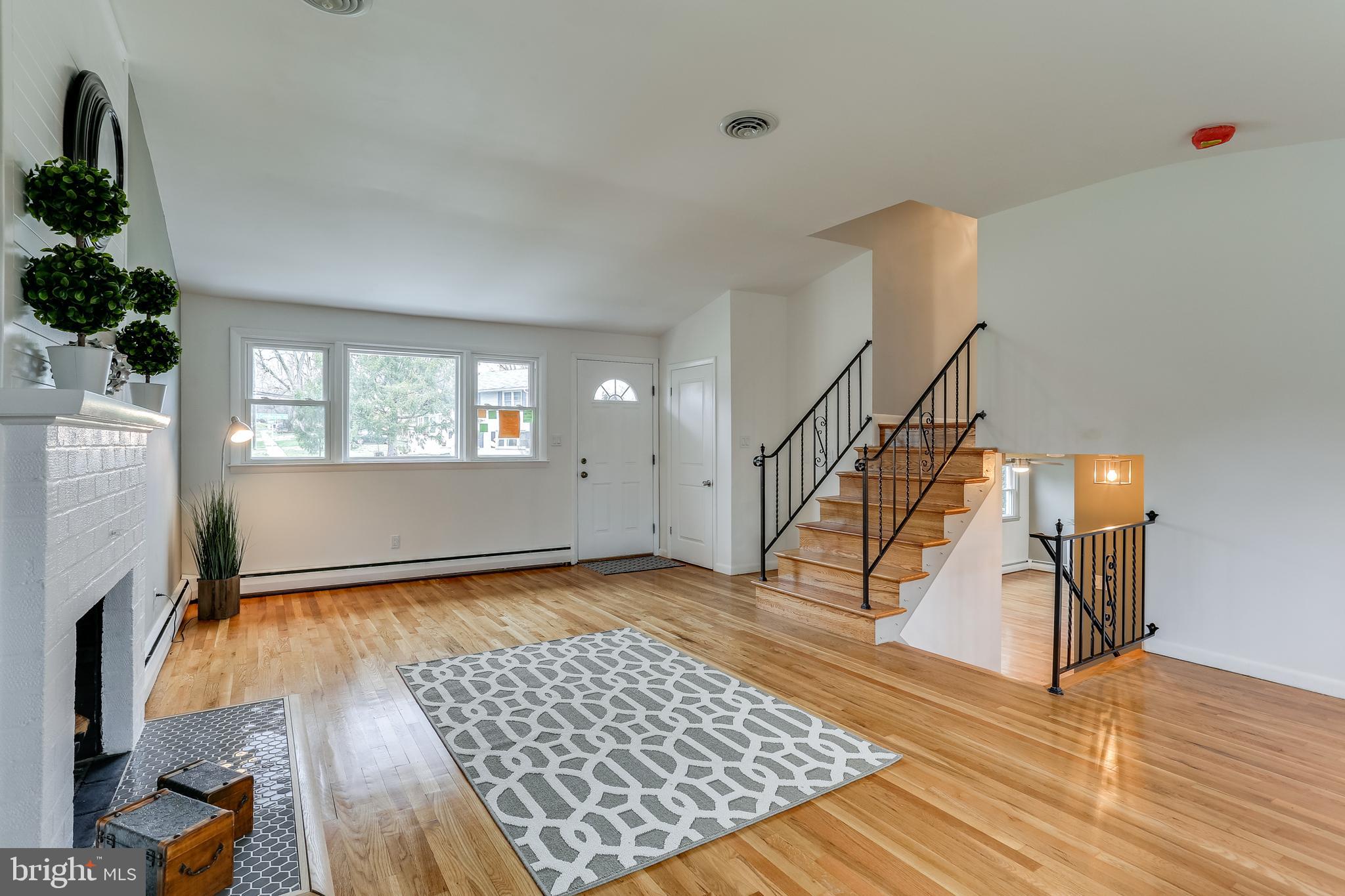 221 Coldbrook Road Lutherville-Timonium, MD 21093 - Photo 5 of 37 Living Room with Oak Stairs to Upper & Lower Level