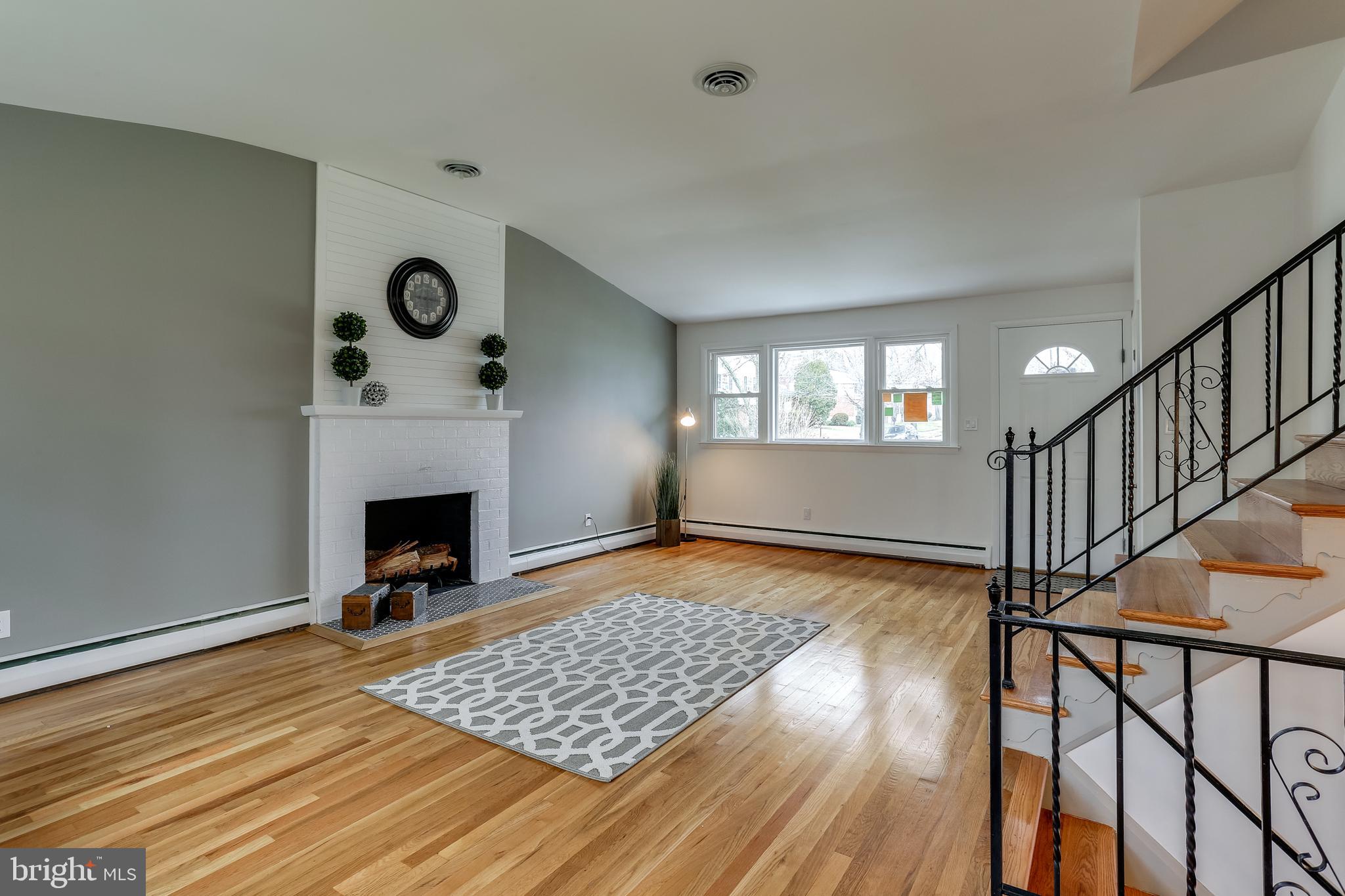 221 Coldbrook Road Lutherville-Timonium, MD 21093 - Photo 6 of 37 Living Room w/ Cathedral Ceiling Ceramic Hearth.