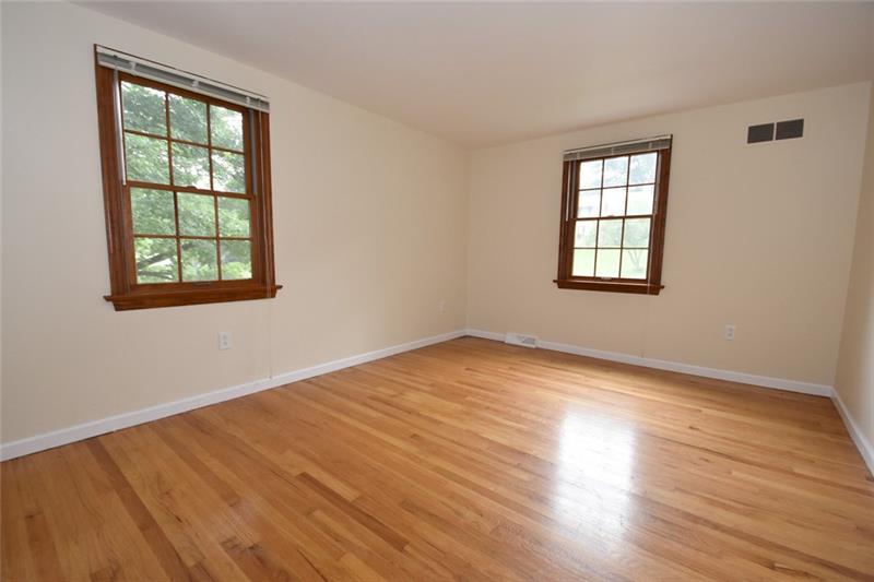 2405 Mill Grove Road Pittsburgh, PA 15241 - Photo 12 of 14 The second bedroom is 14' x 11' with gleaming hardwood floors, neutral paint, two windows and another roomy closet! What a great home! Move-in ready!