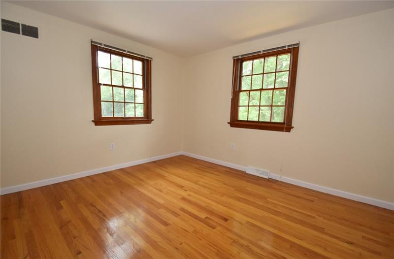 2405 Mill Grove Road Pittsburgh, PA 15241 - Photo 13 of 14 The 4th bedroom is light and bright with 2 windows! This room has gleaming hardwood floors, neutral paint and has good closet space, too!