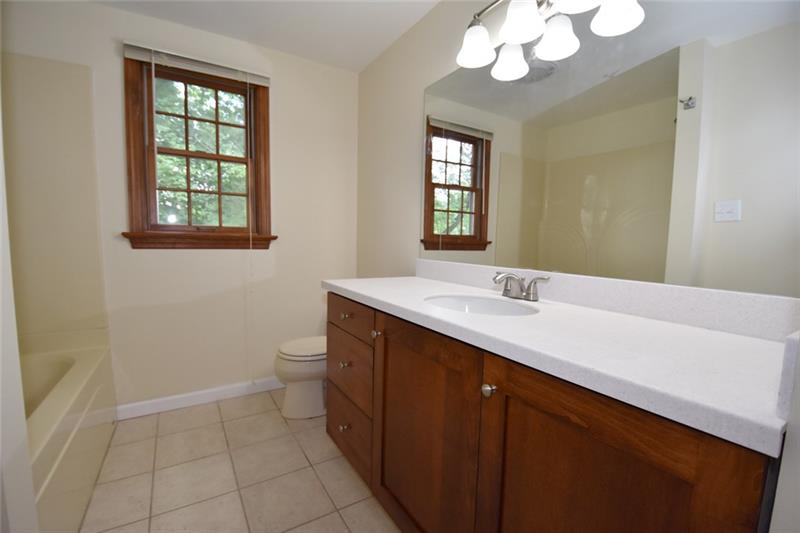 2405 Mill Grove Road Pittsburgh, PA 15241 - Photo 14 of 14 2nd floor hallway bathroom! New vanity, counter top, mirror, lights, flooring, toilets and faucets...Renovated and updated!