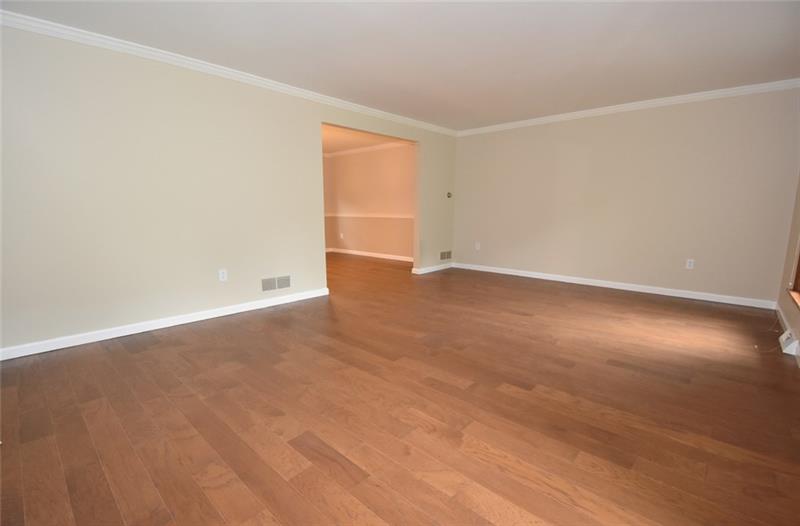 2405 Mill Grove Road Pittsburgh, PA 15241 - Photo 3 of 14 The formal living room is 20' x 14' and has beautiful gleaming hardwood flooring! Neutral paint, crown molding and new baseboard molding! Come and take a look!