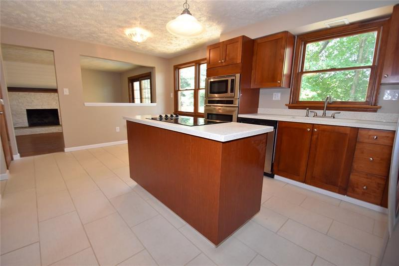 2405 Mill Grove Road Pittsburgh, PA 15241 - Photo 6 of 14 Completely updated 18'x12' eat-in-kitchen with new cabinets, new stainless upgraded appliances, new faucet, lighting, sink, new ceramic tile flooring...all of the bells and whistles! Come and take a look!