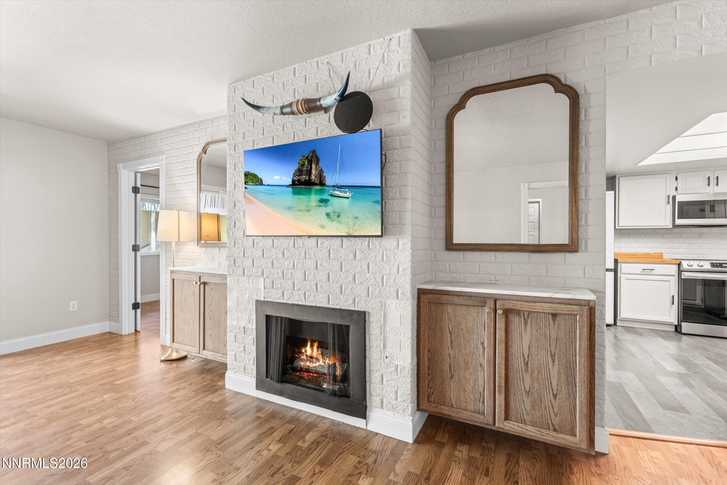2300 Dickerson Road, Unit 51 Reno, NV 89503 - Photo 10 of 46 a living room with stainless steel appliances furniture a fireplace and a fireplace