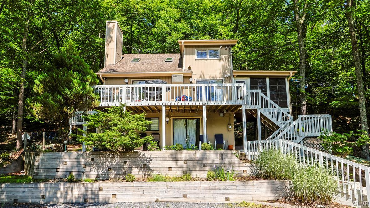 6463 Decker Road Bushkill, PA 18324 - Photo 1 of 50 front view of a house with a small yard