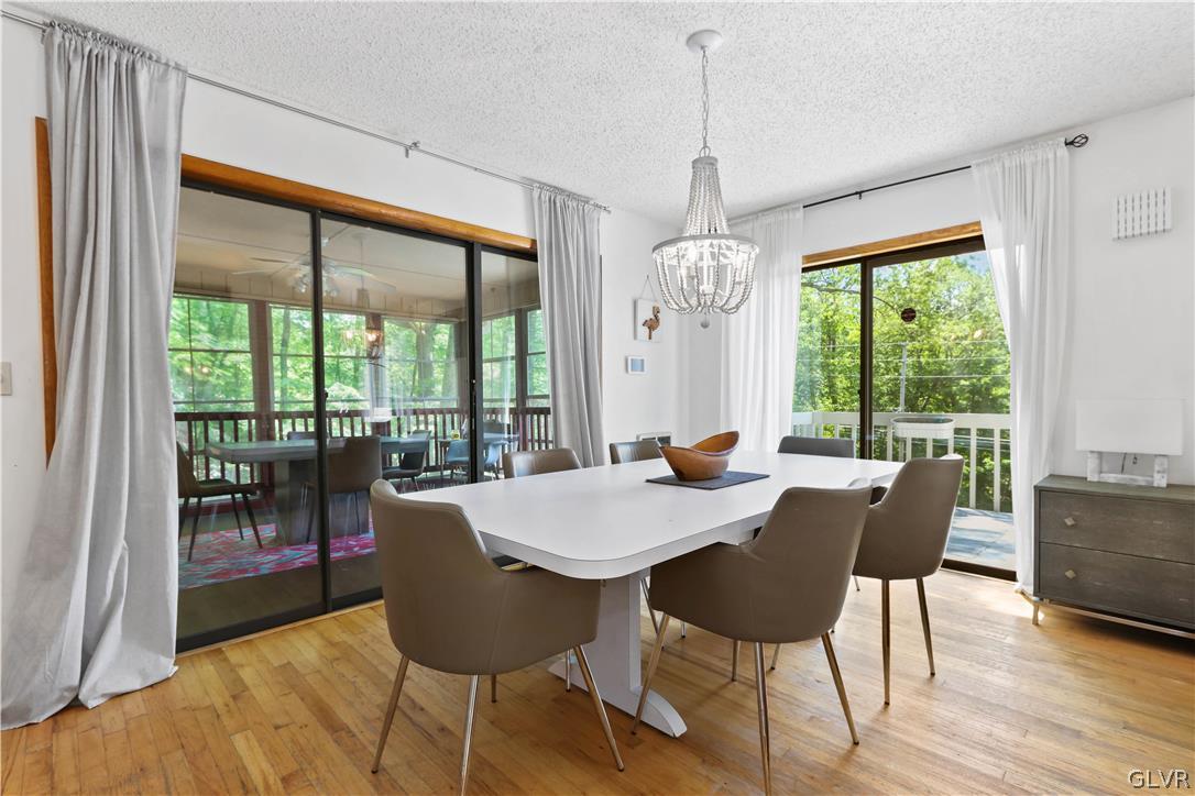 6463 Decker Road Bushkill, PA 18324 - Photo 16 of 50 a view of a dining room with furniture window and wooden floor