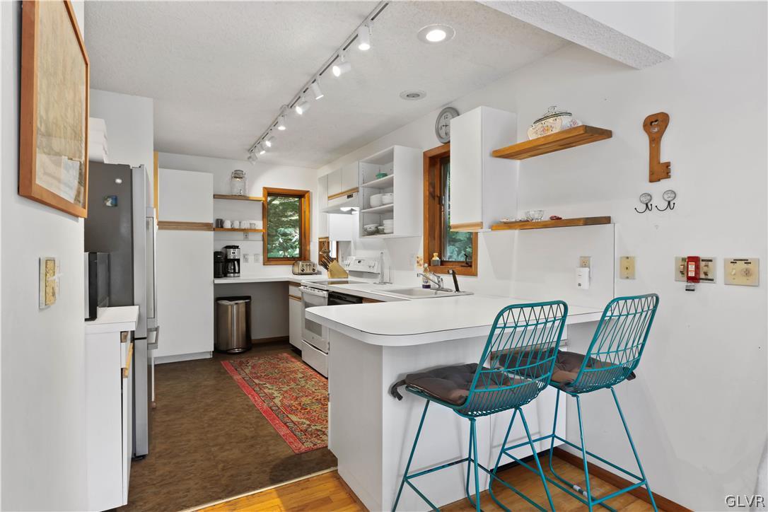 6463 Decker Road Bushkill, PA 18324 - Photo 20 of 50 a view of kitchen with furniture and wooden floor
