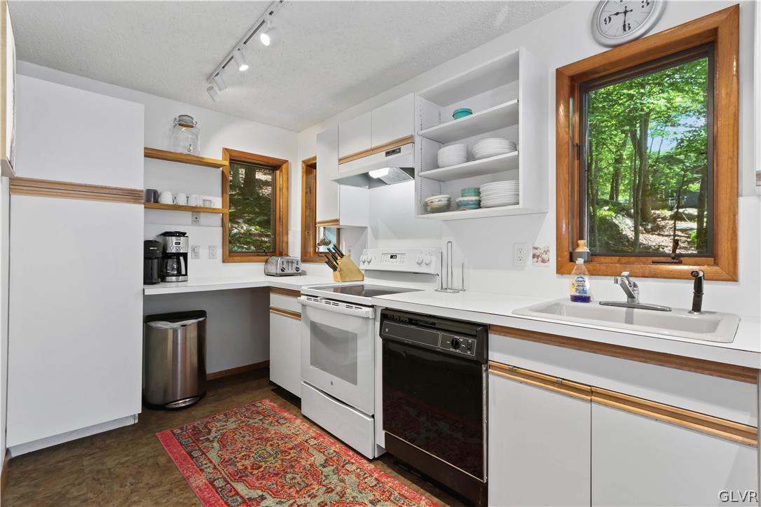 6463 Decker Road Bushkill, PA 18324 - Photo 22 of 50 a kitchen with a sink stove and cabinets