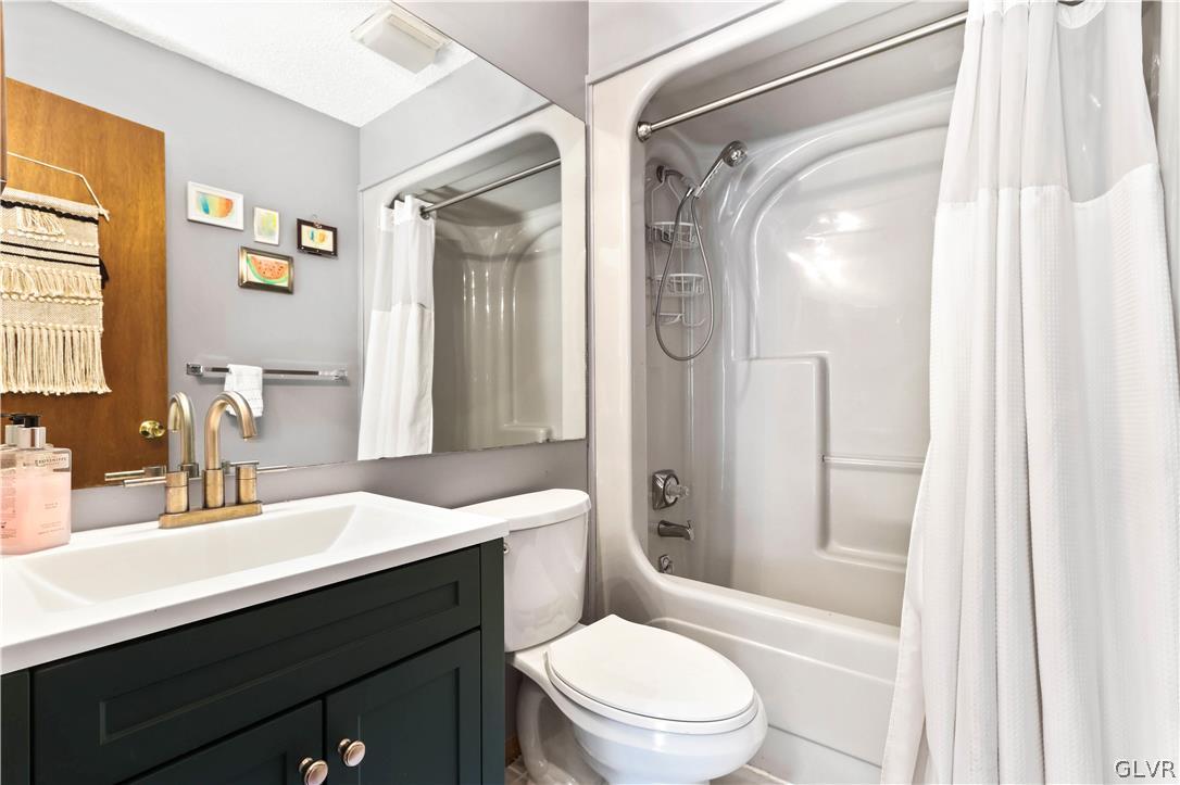 6463 Decker Road Bushkill, PA 18324 - Photo 26 of 50 a bathroom with a sink a toilet and shower