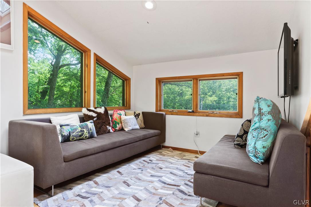 6463 Decker Road Bushkill, PA 18324 - Photo 28 of 50 a living room with furniture and a large window