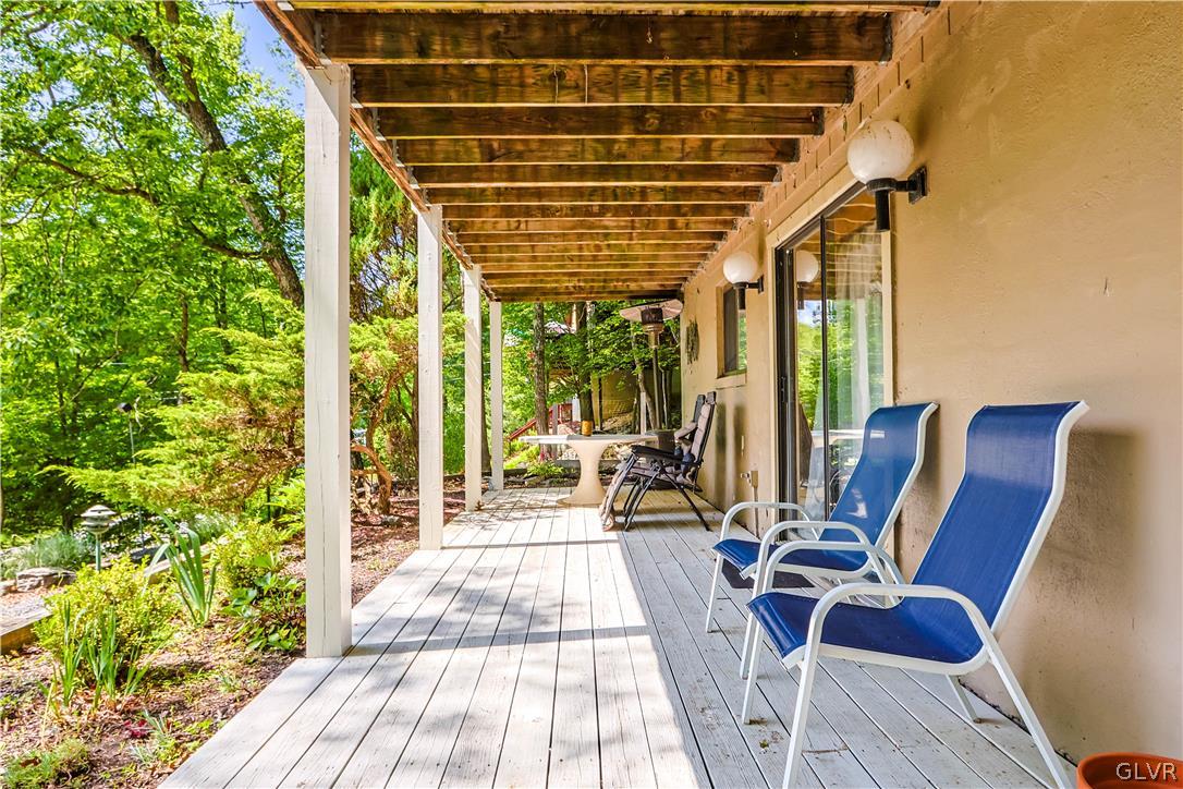 6463 Decker Road Bushkill, PA 18324 - Photo 4 of 50 a view of balcony with wooden floor and outdoor seating