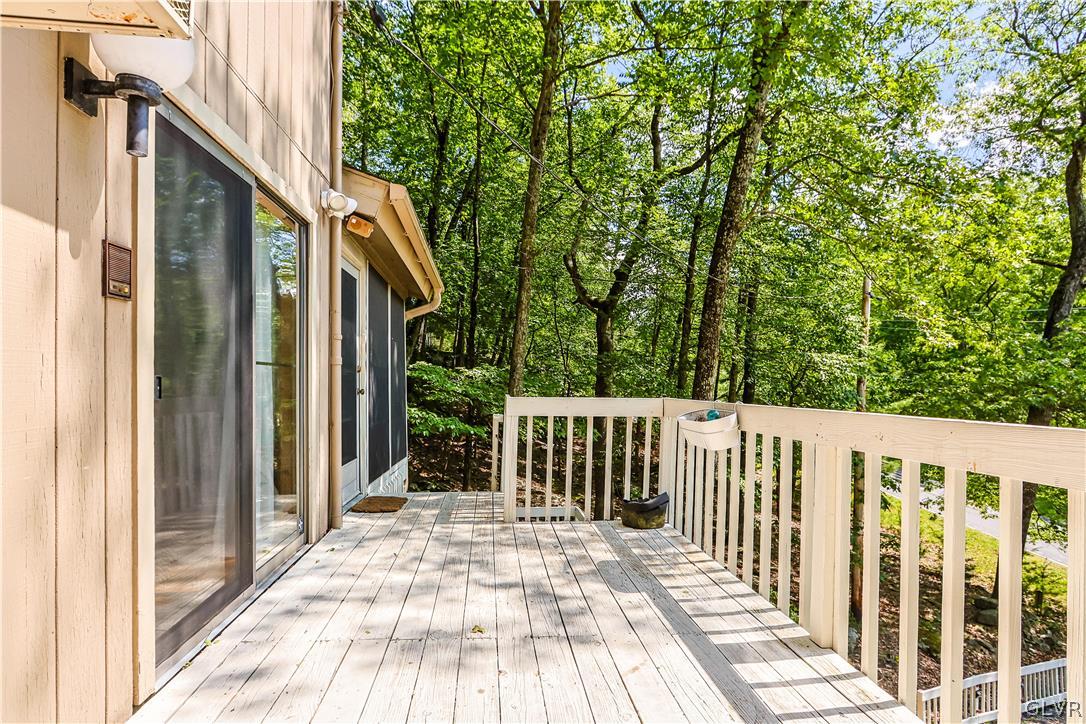 6463 Decker Road Bushkill, PA 18324 - Photo 6 of 50 a view of a wooden house with a wooden bench