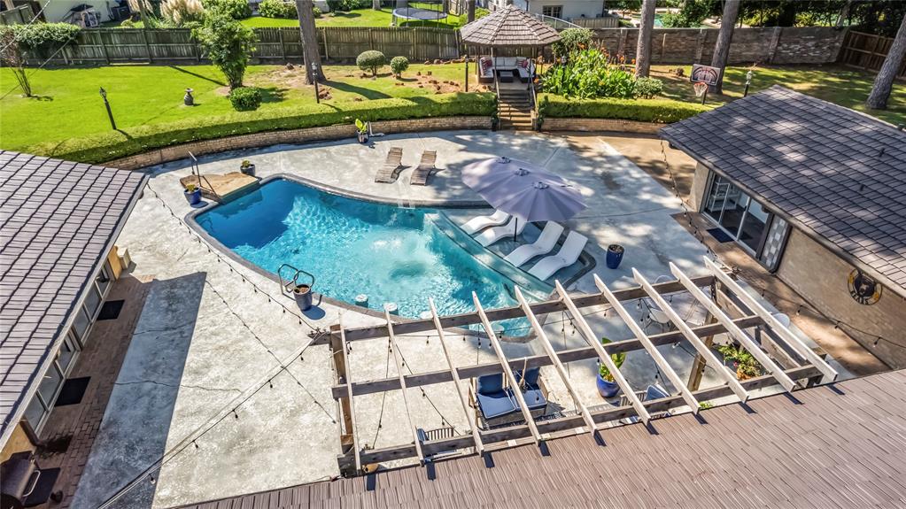 1300 Montclair Street Longview, TX 75601 - Photo 33 of 39 View of pool featuring a fenced backyard and a patio area
