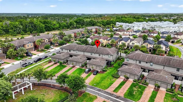 an aerial view of residential houses with outdoor space