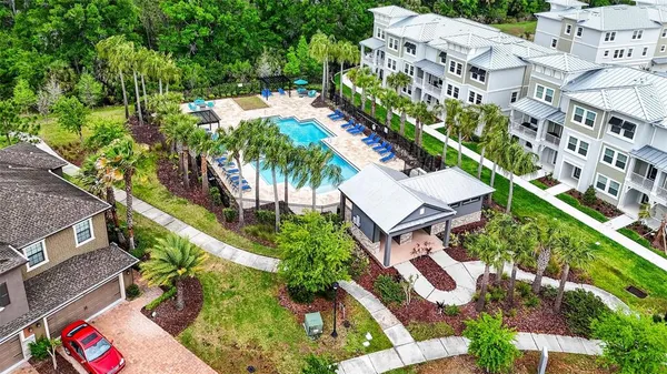 an aerial view of multiple houses with yard