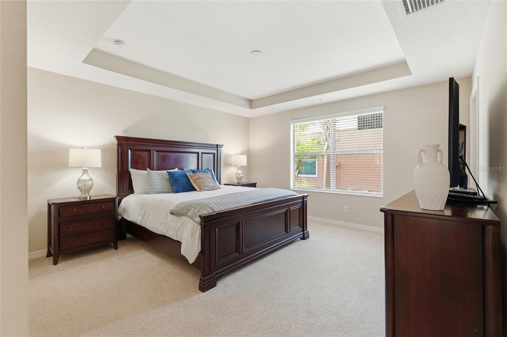 7321 Skybird Road, Unit 397 Bradenton, FL 34209 - Photo 12 of 35 a bed sitting in a bedroom next to a window