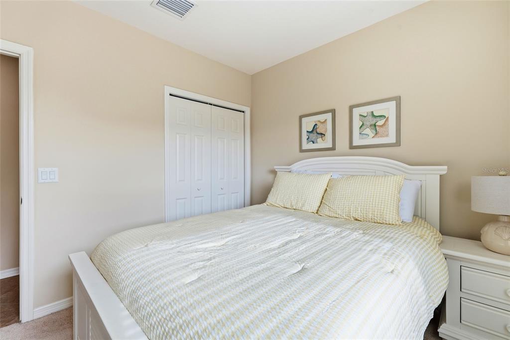 7321 Skybird Road, Unit 397 Bradenton, FL 34209 - Photo 19 of 35 a bedroom with a bed and a wall painting