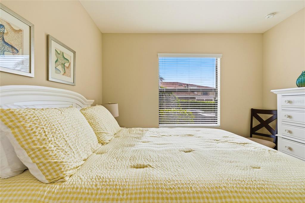 7321 Skybird Road, Unit 397 Bradenton, FL 34209 - Photo 20 of 35 a bedroom with a bed and wooden floor