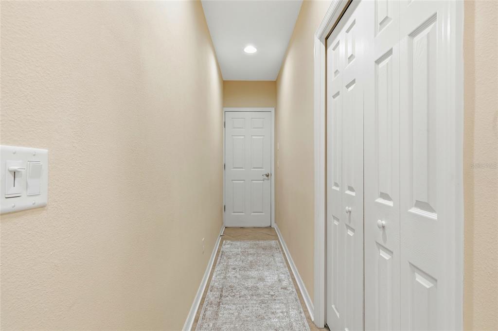 7321 Skybird Road, Unit 397 Bradenton, FL 34209 - Photo 23 of 35 a view of a hallway with white walls