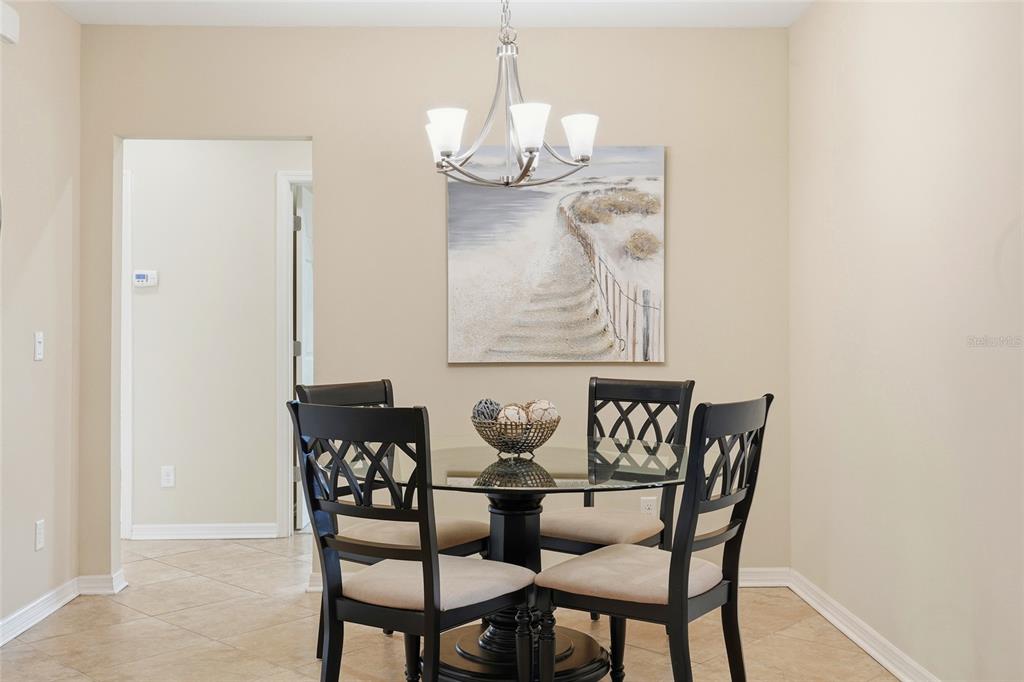 7321 Skybird Road, Unit 397 Bradenton, FL 34209 - Photo 27 of 35 a dining room with furniture and window