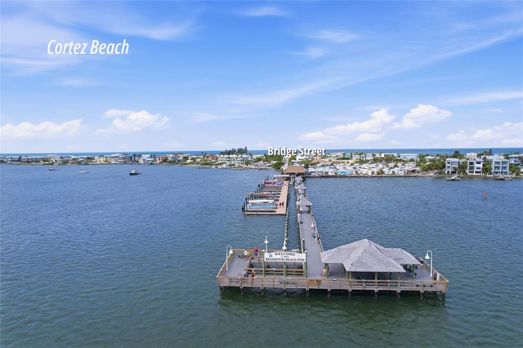 7321 Skybird Road, Unit 397 Bradenton, FL 34209 - Photo 31 of 35 a view of a lake with boats and trees in the background