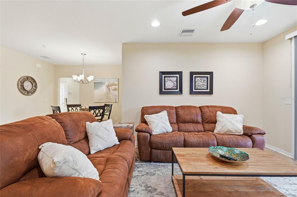 7321 Skybird Road, Unit 397 Bradenton, FL 34209 - Photo 6 of 35 a living room with furniture and a large window