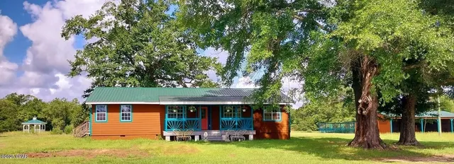 an outdoor view of house with yard