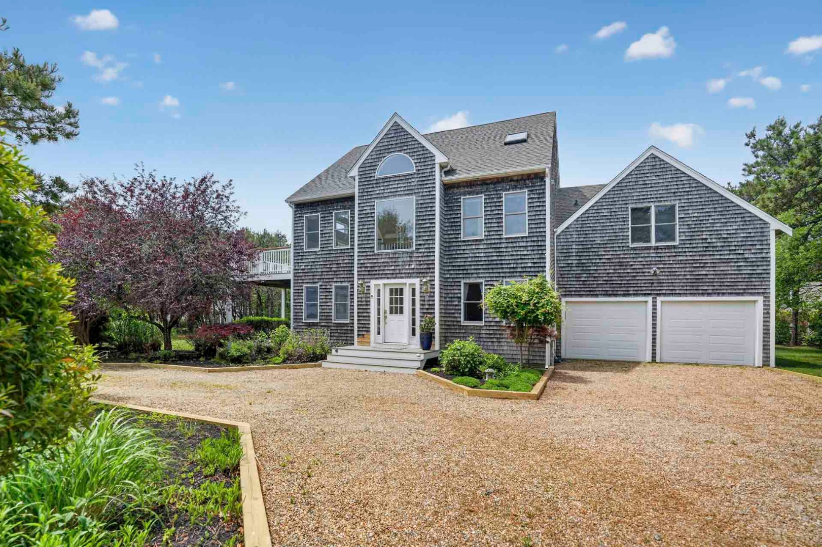 9 Thaxter Lane Edgartown, MA 02539 - Photo 4 of 53 a front view of a house with garden