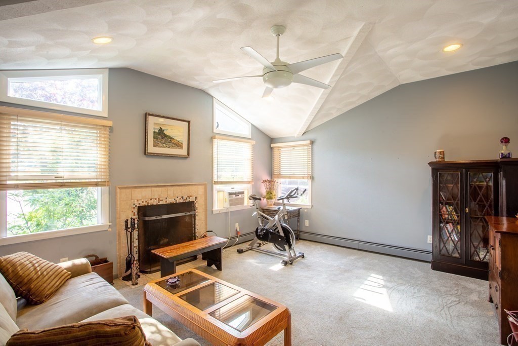 7 Temi Road Beverly, MA 01915 - Photo 13 of 40 a living room with furniture a fireplace and a window