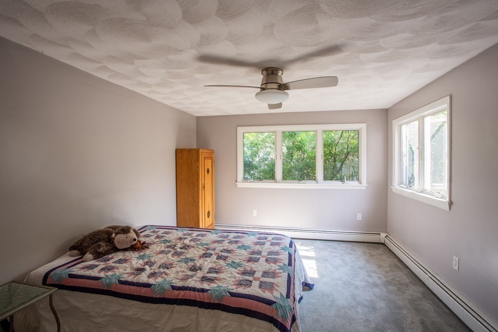 7 Temi Road Beverly, MA 01915 - Photo 16 of 40 a bedroom with a bed and a window