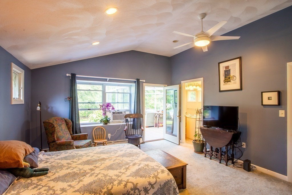 7 Temi Road Beverly, MA 01915 - Photo 20 of 40 a bedroom with a bed and large windows