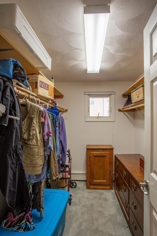 7 Temi Road Beverly, MA 01915 - Photo 27 of 40 a view of walk in closet with clothes and shoes
