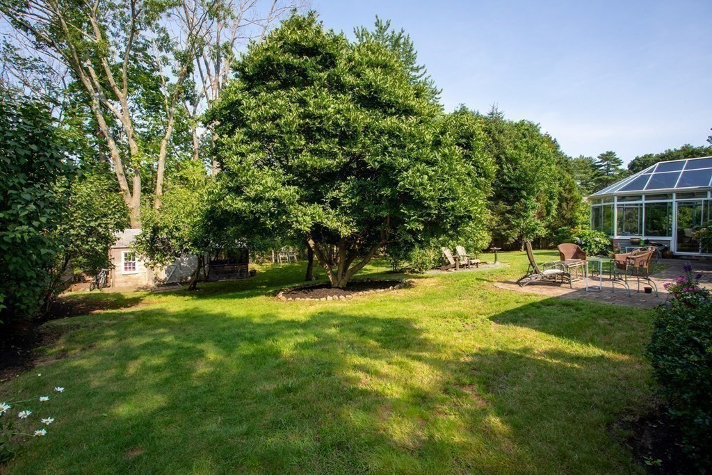 7 Temi Road Beverly, MA 01915 - Photo 29 of 40 a backyard of a house with table and chairs