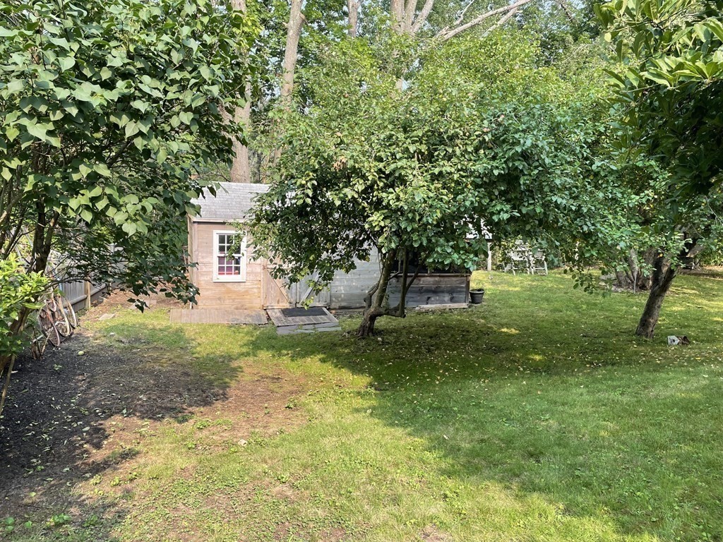 7 Temi Road Beverly, MA 01915 - Photo 34 of 40 a front view of a house with a yard