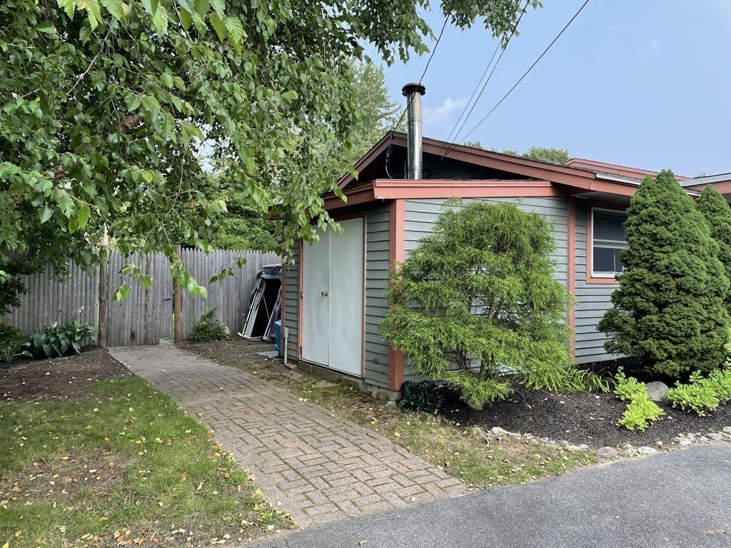 7 Temi Road Beverly, MA 01915 - Photo 39 of 40 a front view of a house with garden