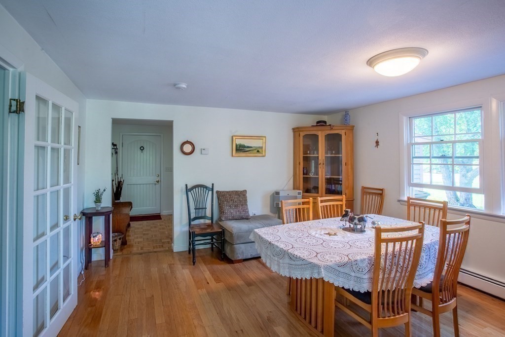 7 Temi Road Beverly, MA 01915 - Photo 5 of 40 a view of a dining room with furniture window and wooden floor