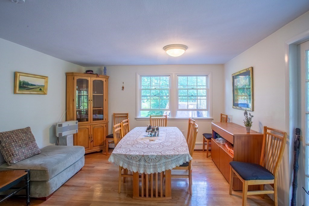 7 Temi Road Beverly, MA 01915 - Photo 6 of 40 a living room with furniture a table and a large window
