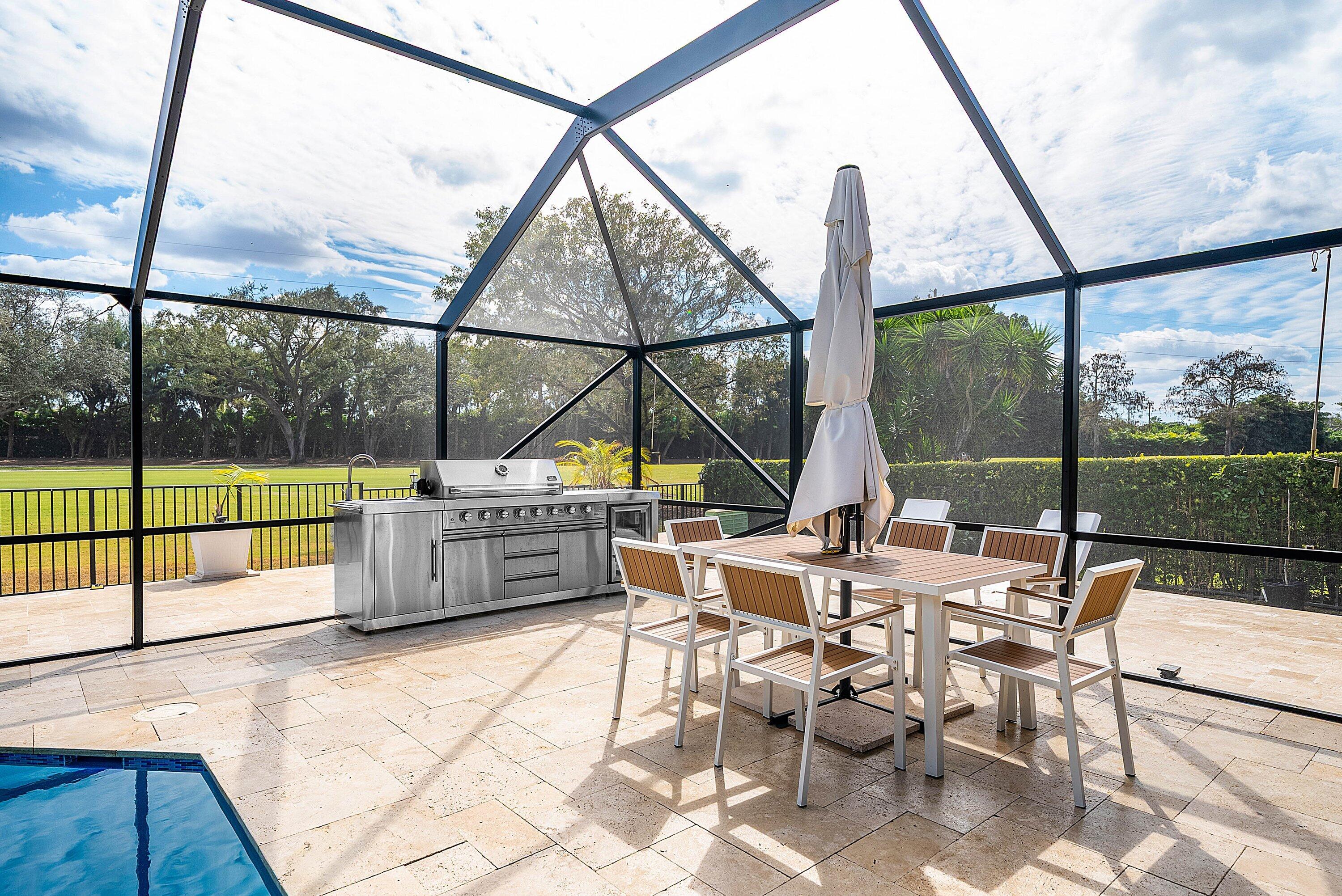 10710 Boca Woods Lane Boca Raton, FL 33428 - Photo 2 of 44 a view of living room with furniture and large windows
