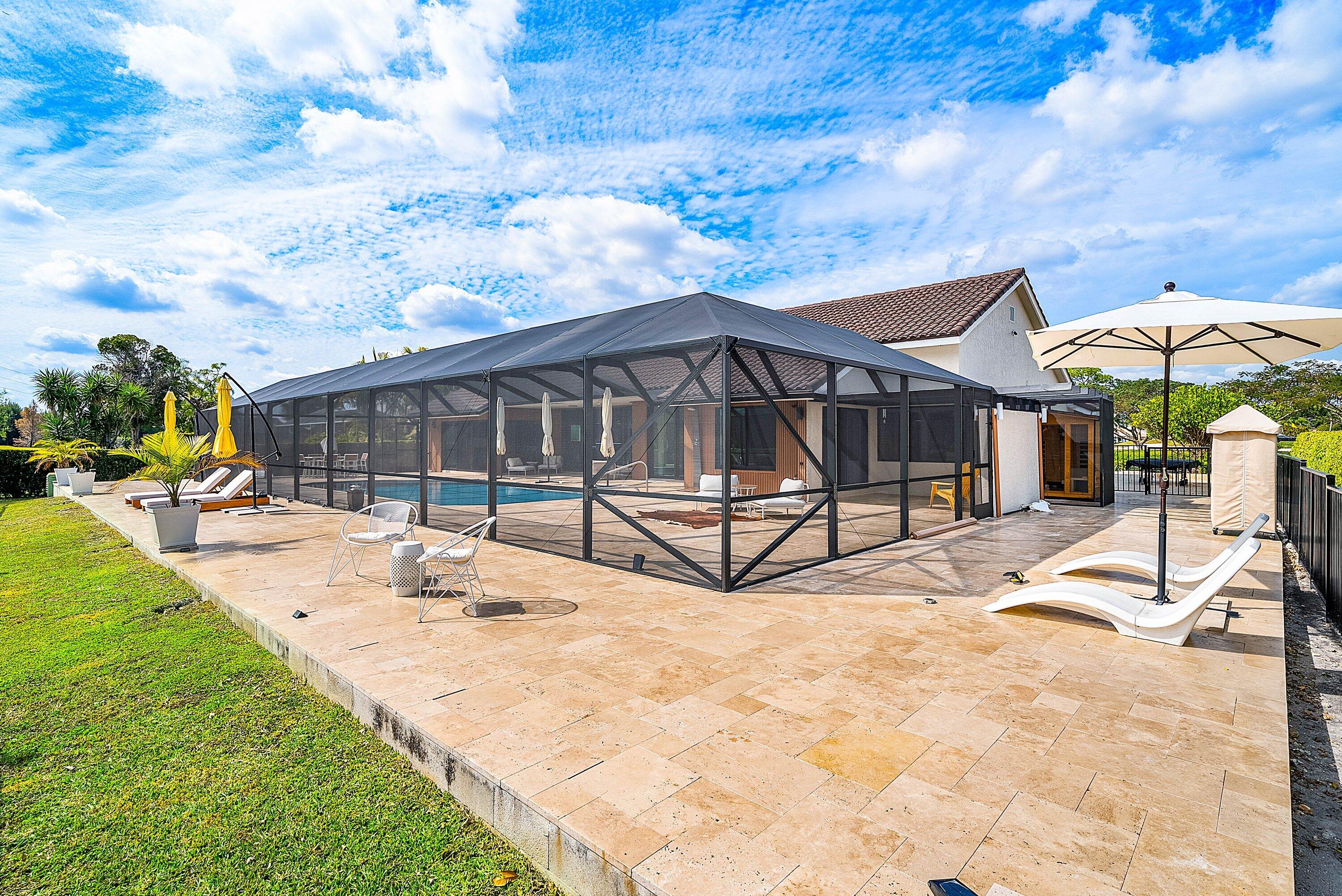10710 Boca Woods Lane Boca Raton, FL 33428 - Photo 21 of 44 a view of swimming pool with a lounge chair